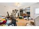 Living room with hardwood floors, a ceiling fan, and an open doorway at 5181 Saint Claire Pl, Powder Springs, GA 30127