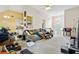 Bright living room featuring carpet, a ceiling fan, and access to the kitchen at 5181 Saint Claire Pl, Powder Springs, GA 30127