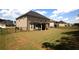 Spacious backyard with a covered patio and black metal fence, perfect for outdoor entertaining at 812 Graeme Dr, Mcdonough, GA 30252