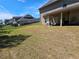 Fenced backyard featuring a covered patio and a large green lawn at 812 Graeme Dr, Mcdonough, GA 30252