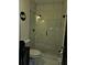 Updated bathroom features a glass enclosed shower with white marble surround and pebbled shower floor at 812 Graeme Dr, Mcdonough, GA 30252
