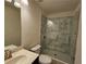 This spacious updated bathroom features a walk-in glass shower and sink with marble countertop at 812 Graeme Dr, Mcdonough, GA 30252