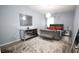 A beautifully decorated bedroom with a plush rug, mirrored dresser, and elegant light fixture at 812 Graeme Dr, Mcdonough, GA 30252
