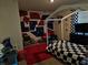 Unique bedroom features a rock climbing wall and black and white checkered bed at 812 Graeme Dr, Mcdonough, GA 30252