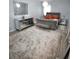A beautifully decorated bedroom with a plush rug, mirrored dresser, and elegant light fixture at 812 Graeme Dr, Mcdonough, GA 30252