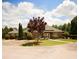 Exterior of the brick clubhouse with well-maintained landscaping at 812 Graeme Dr, Mcdonough, GA 30252