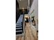 Elegant two-story foyer with a staircase, wood floors, and wainscoting at 812 Graeme Dr, Mcdonough, GA 30252