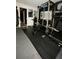 Basement gym featuring exercise equipment and a weight rack at 812 Graeme Dr, Mcdonough, GA 30252