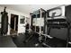 Basement gym featuring exercise equipment and a weight rack at 812 Graeme Dr, Mcdonough, GA 30252