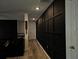 Hallway features dark wood plank flooring and dark wall panelling at 812 Graeme Dr, Mcdonough, GA 30252