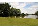 A picturesque view of a peaceful lake surrounded by lush greenery and trees at 812 Graeme Dr, Mcdonough, GA 30252
