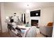 Bright living room featuring modern furniture, a fireplace, and a decorative lighting fixture at 812 Graeme Dr, Mcdonough, GA 30252
