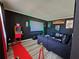Unique living room with a red carpet, movie-themed decor, and a comfortable seating area at 812 Graeme Dr, Mcdonough, GA 30252