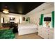 This is a large main bedroom with a king bed, ensuite bathroom, and exercise equipment at 812 Graeme Dr, Mcdonough, GA 30252