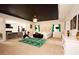 This is a large main bedroom with a sitting area, fireplace, exercise equipment, and an ensuite bathroom at 812 Graeme Dr, Mcdonough, GA 30252