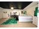 This is a large main bedroom with a sitting area, fireplace, exercise equipment, and an ensuite bathroom at 812 Graeme Dr, Mcdonough, GA 30252