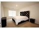 Bedroom featuring modern decor, a window, and an accent wall at 812 Graeme Dr, Mcdonough, GA 30252