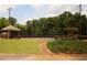 A beautiful tennis court surrounded by lush greenery at 812 Graeme Dr, Mcdonough, GA 30252