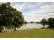 Picturesque view of the lakefront property on a sunny day, with trees framing the tranquil water at 812 Graeme Dr, Mcdonough, GA 30252