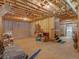 Unfinished basement with exposed beams and open space, ready to be customized to your dreams at 925 Champions Way, Mcdonough, GA 30252