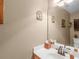 Half-bath with a single sink, a mirror and neutral walls at 925 Champions Way, Mcdonough, GA 30252