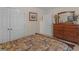 Bedroom with double closets, dresser, and comfortable bed at 925 Champions Way, Mcdonough, GA 30252
