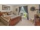Comfortable bedroom with a large window and natural light at 925 Champions Way, Mcdonough, GA 30252