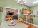 Cozy dining space adjacent to a living room, featuring a bar counter with wicker stools at 925 Champions Way, Mcdonough, GA 30252