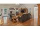 Spacious living room with a fireplace, comfortable seating, and hardwood floors at 925 Champions Way, Mcdonough, GA 30252