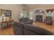 Inviting living room with a fireplace, comfortable sofa, and natural lighting at 925 Champions Way, Mcdonough, GA 30252