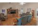 Cozy living room featuring hardwood floors, TV, and comfortable seating at 925 Champions Way, Mcdonough, GA 30252