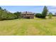 Spacious backyard featuring a well-maintained lawn and mature trees, offering a serene and private outdoor space at 127 Grayson Myers Dr, Villa Rica, GA 30180