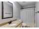 Bright bathroom featuring granite vanity, neutral walls and shower-tub combination at 127 Grayson Myers Dr, Villa Rica, GA 30180