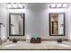 Well-appointed bathroom with double vanities, granite countertops, and framed mirrors for a sophisticated touch at 127 Grayson Myers Dr, Villa Rica, GA 30180