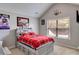 Cozy bedroom with a red plaid bedspread and window view at 127 Grayson Myers Dr, Villa Rica, GA 30180