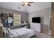 Bright bedroom featuring carpet, vaulted ceiling, fan and white decor at 127 Grayson Myers Dr, Villa Rica, GA 30180