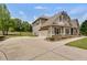 Spacious driveway leading to a beautiful home with an attached garage at 127 Grayson Myers Dr, Villa Rica, GA 30180