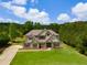 Beautiful craftsman style home featuring a long drive, and well manicured lawn at 127 Grayson Myers Dr, Villa Rica, GA 30180