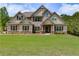 Charming traditional home with well-maintained lawn and landscaping at 127 Grayson Myers Dr, Villa Rica, GA 30180