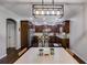 Well-designed kitchen with dark cabinets, stainless steel appliances, and an island with seating, ideal for casual dining at 127 Grayson Myers Dr, Villa Rica, GA 30180