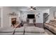 Cozy living room with a fireplace and hardwood flooring; wall shelves add personal touch at 127 Grayson Myers Dr, Villa Rica, GA 30180