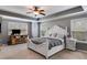 Serene main bedroom with tray ceiling, large windows, and ample space for relaxation and rest at 127 Grayson Myers Dr, Villa Rica, GA 30180