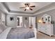 Bright main bedroom offering generous space, a tray ceiling, and neutral decor for a calming retreat at 127 Grayson Myers Dr, Villa Rica, GA 30180