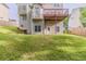 View of a backyard featuring a deck and a walkout basement at 3717 Lockerbie Ln, Powder Springs, GA 30127