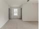 Spacious bedroom with neutral carpet, ceiling fan, and double door entry at 3717 Lockerbie Ln, Powder Springs, GA 30127