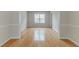 Light-filled dining area with beautiful wood floors and views to the outside at 3717 Lockerbie Ln, Powder Springs, GA 30127