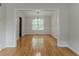 Bright dining room with hardwood floors, chair rail and ample space for entertaining at 3717 Lockerbie Ln, Powder Springs, GA 30127