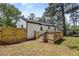 White home with wooden deck and fenced yard, ideal for outdoor activities and privacy at 4134 Burgess Dr, Decatur, GA 30035
