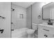 Clean, modern bathroom featuring gray marble, bathtub, and white vanity at 4134 Burgess Dr, Decatur, GA 30035