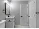 Well-lit bathroom with modern fixtures, white vanity, and clean tile at 4134 Burgess Dr, Decatur, GA 30035